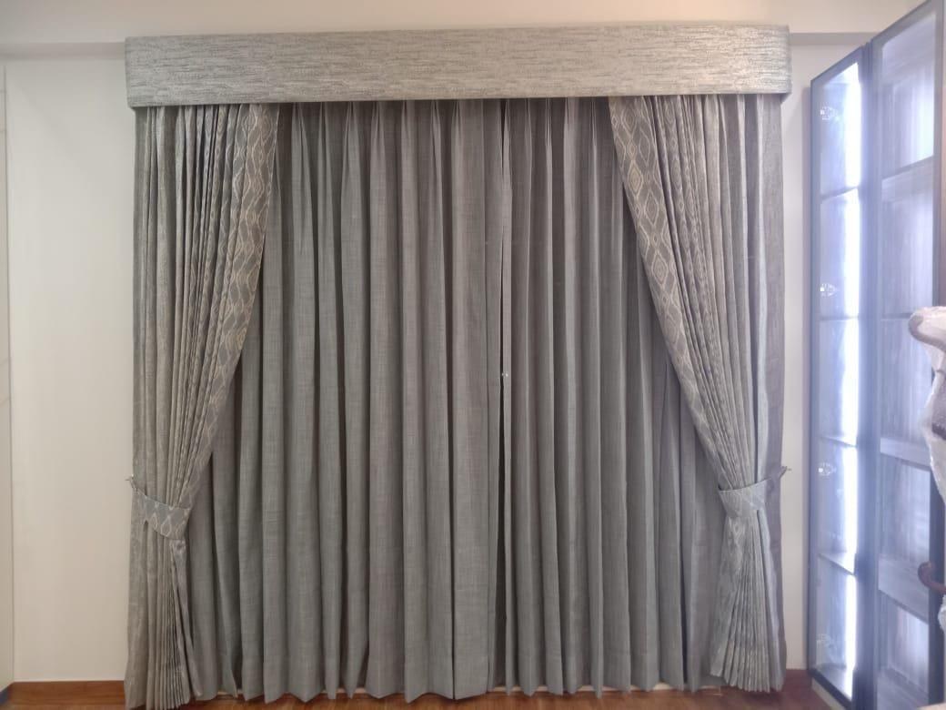 Silver-grey curtain fabric with a coordinated finish.
