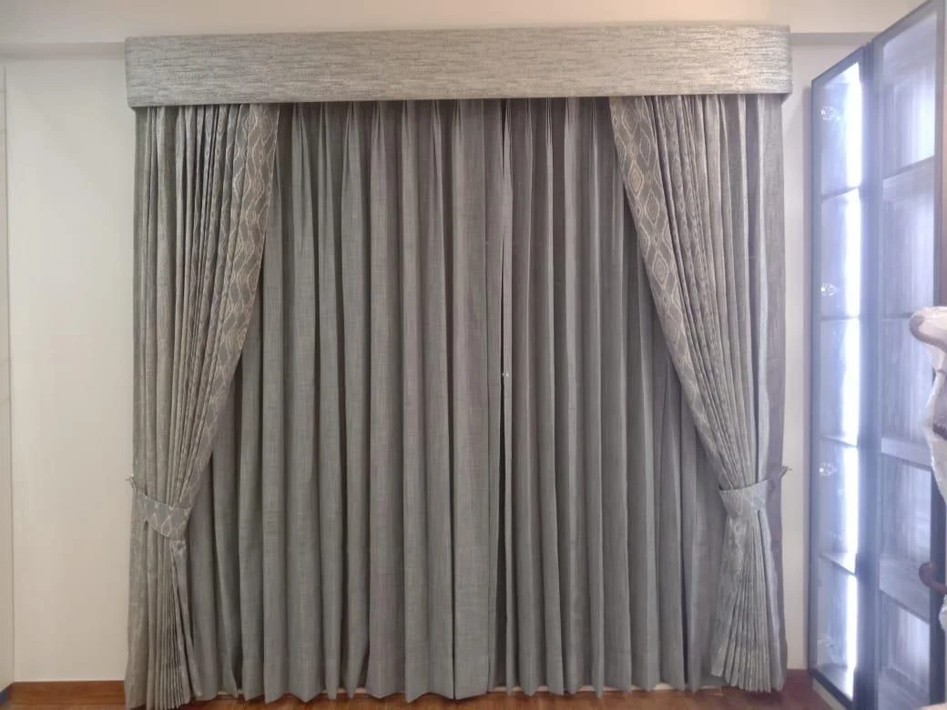 Silver-grey curtains with a coordinated upper finish.